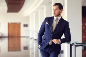 Professional wearing a tailored navy business suit in Riyadh demonstrating year-round business wardrobe style in Saudi Arabia
