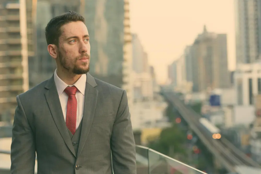 Professional wearing a light grey tailored business suit in Saudi Arabia