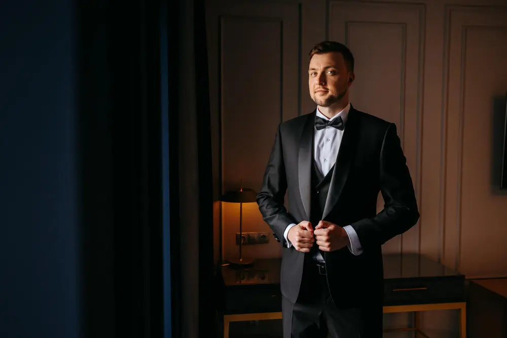 Businessman wearing a bespoke suit at a luxury hotel in Abu Dhabi.