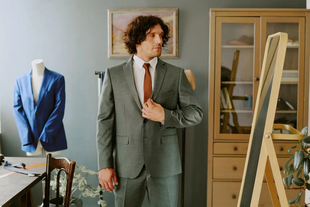 Bespoke tailor creating a custom suit showcasing the long-term value of bespoke tailoring as a wardrobe investment.