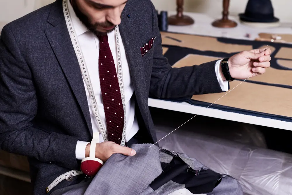 Close-up of bespoke suit construction showing craftsmanship and structural details.